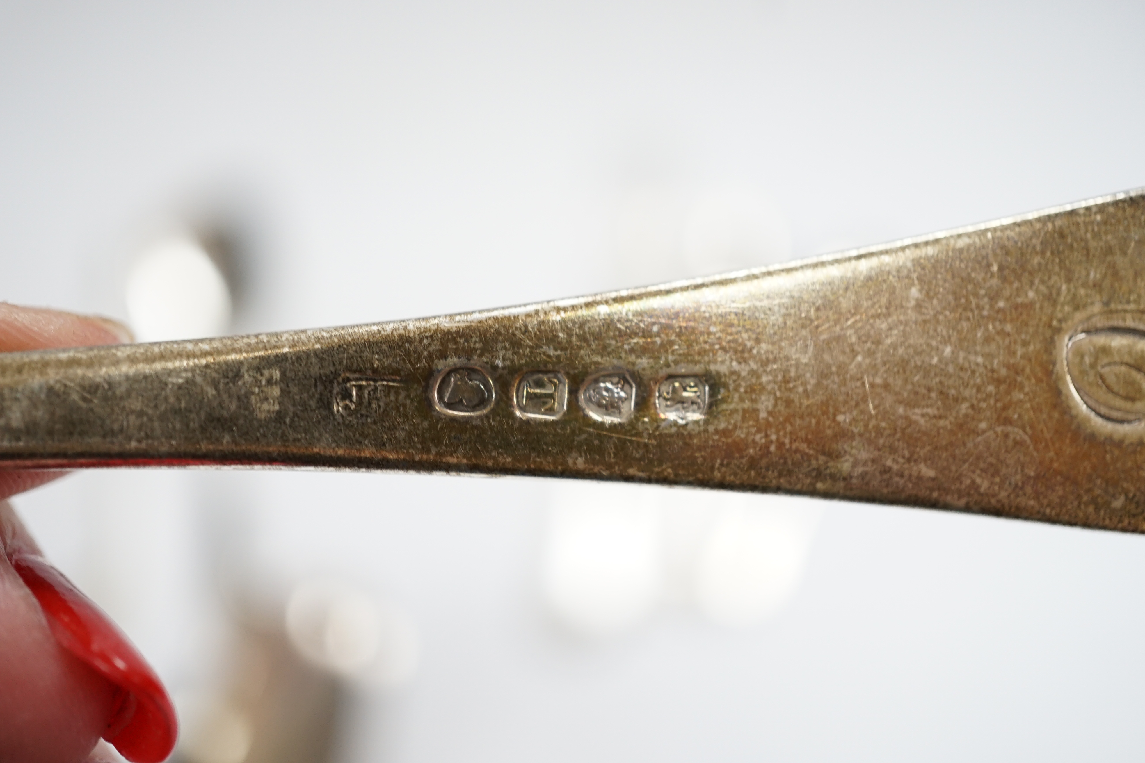 A small quantity of 19th century and later silver flatware, including three pairs of Georgian sugar tongs and nine 19th century and later three pronged forks